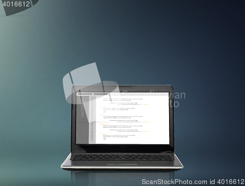 Image of laptop computer with coding on screen