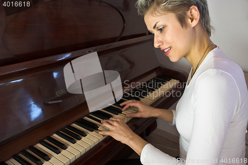 Image of woman and piano