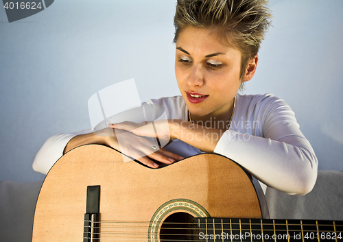 Image of woman and guitar