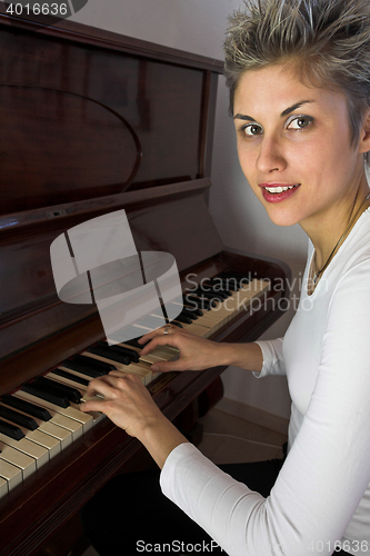 Image of woman and piano