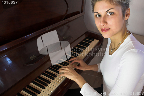 Image of woman and piano
