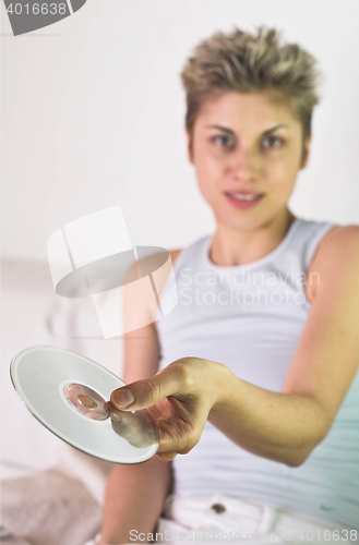 Image of woman and CD