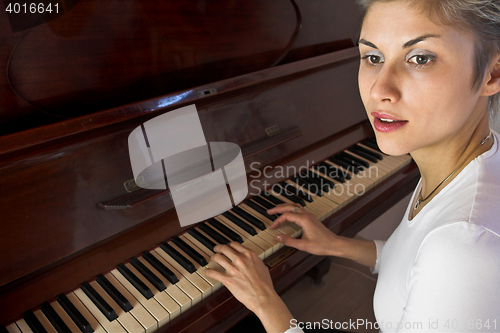 Image of woman and piano