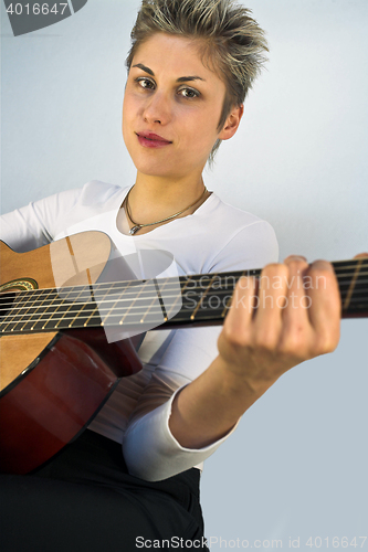 Image of woman and guitar