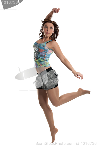 Image of Successful young attractive laughing woman jumping up