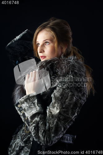 Image of Attractive woman in fur coat