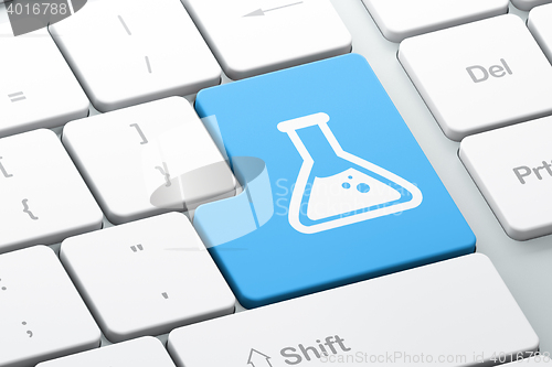 Image of Science concept: Flask on computer keyboard background