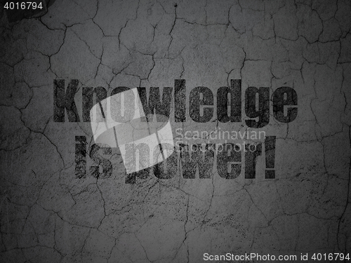 Image of Learning concept: Knowledge Is power! on grunge wall background