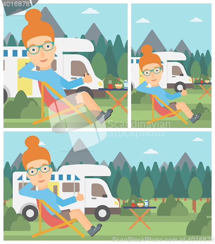 Image of Woman sitting in chair in front of camper van.