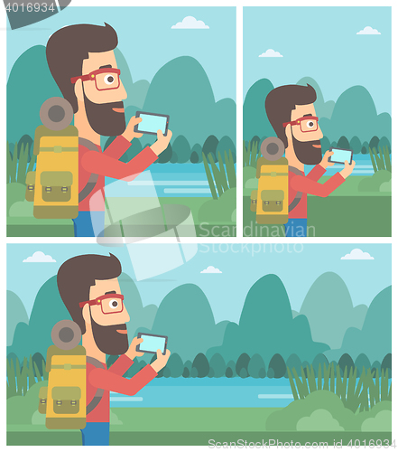Image of Man with backpack taking photo.