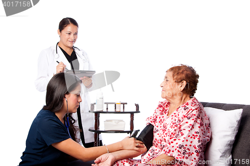 Image of Nurse measuring blood pressure