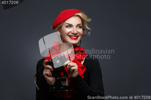 Image of Beautiful lady with retro photo camera