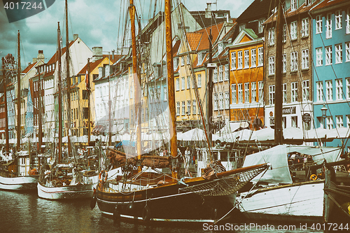 Image of COPENHAGEN, DENMARK - AUGUST 14, 2016: Boats in the docks Nyhavn