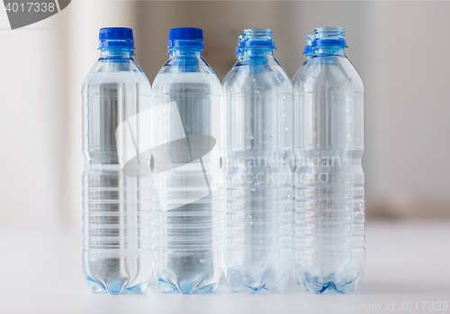 Image of close up of bottles with drinking water on table