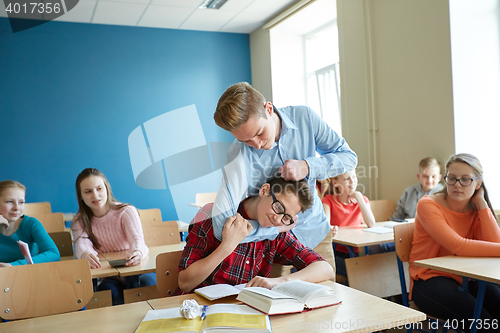 Image of student boy suffering of classmate mockery