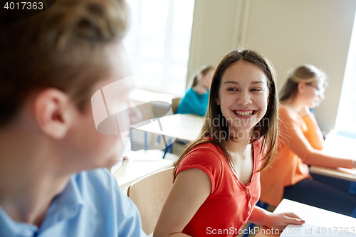 Image of group of happy students talking at school break