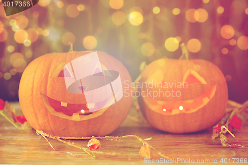 Image of close up of carved halloween pumpkins on table