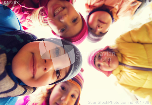 Image of group of happy children faces in circle