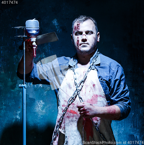 Image of Bloody Halloween theme: crazy killer as butcher