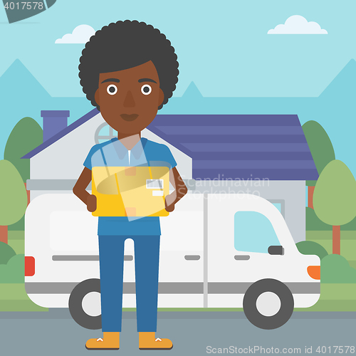 Image of Delivery woman carrying cardboard boxes.
