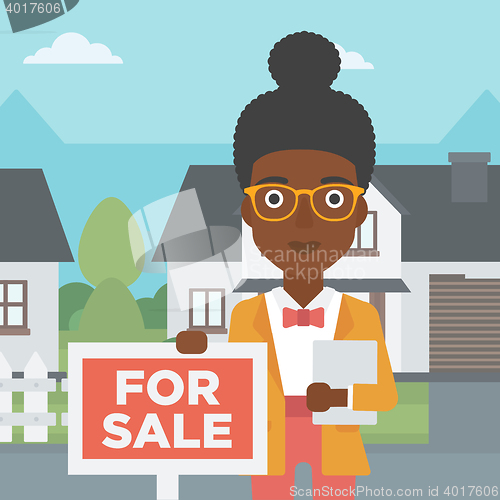 Image of Real estate agent offering house.