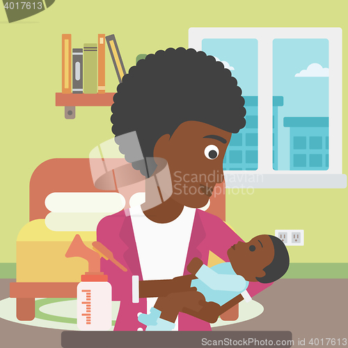 Image of Mother with baby and breast pump.