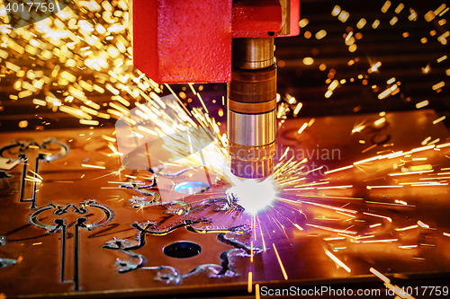 Image of CNC Laser plasma cutting of metal, modern industrial technology.