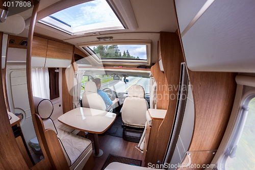 Image of Man driving on a road in the Camper Van