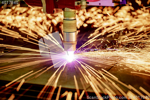 Image of CNC Laser plasma cutting of metal, modern industrial technology.