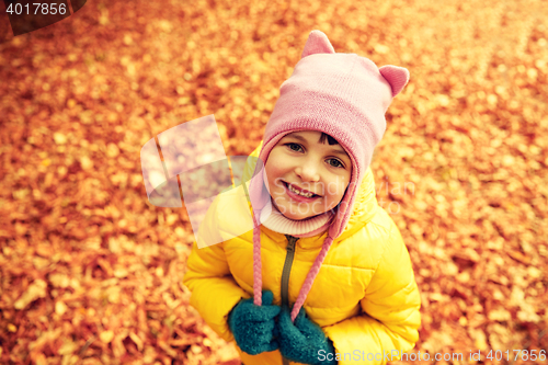 Image of happy little girl in autumn park