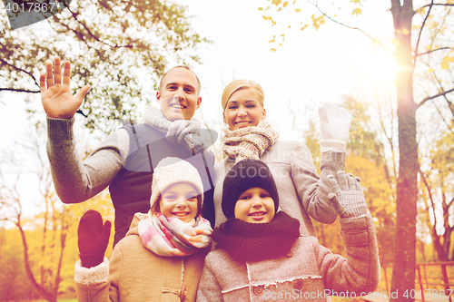 Image of happy family in autumn park