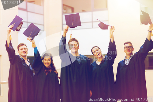 Image of group of smiling students in mortarboards