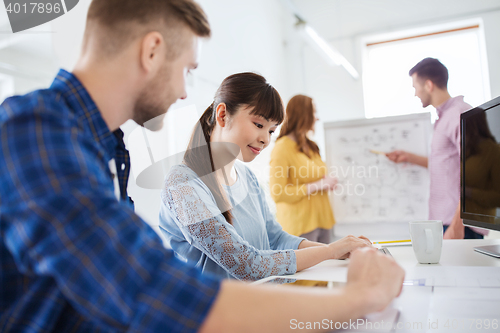 Image of creative team with tablet pc computer at office