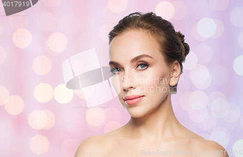 Image of beautiful young woman face over white background