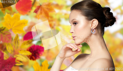 Image of close up of beautiful woman face with earring