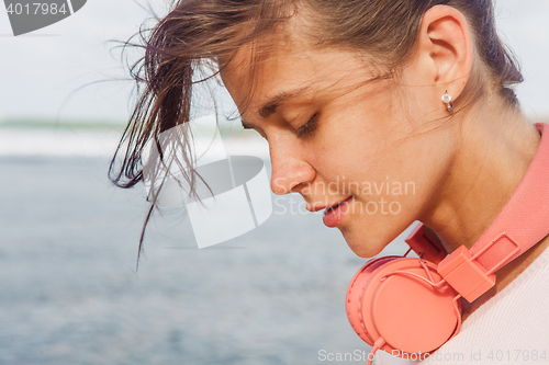 Image of Woman walking on the beach