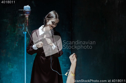 Image of Portrait of a young girl in school uniform as killer woman