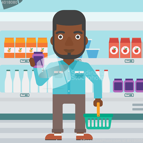 Image of Customer with shopping basket and tube of cream.