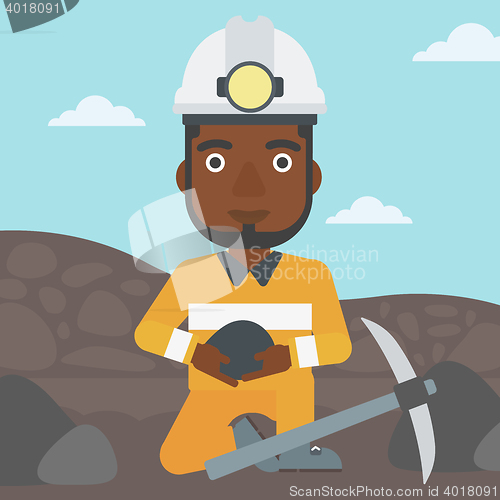 Image of Miner holding coal in hands vector illustration.