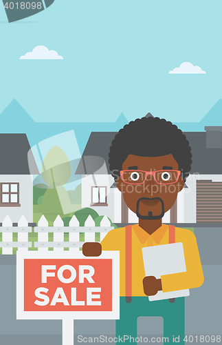 Image of Real estate agent offering house.