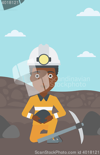 Image of Miner holding coal in hands vector illustration.