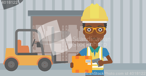 Image of Warehouse worker scanning barcode on box.