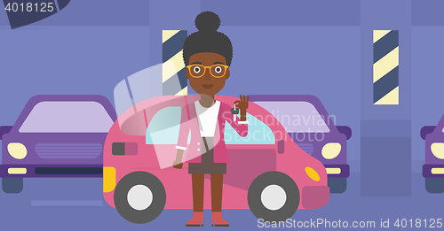 Image of Woman holding keys to her new car.