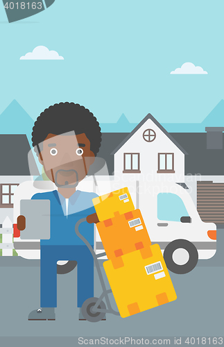 Image of Delivery man with cardboard boxes.