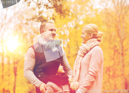 Image of happy family in autumn park