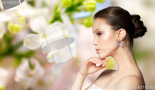 Image of close up of beautiful woman face with earring