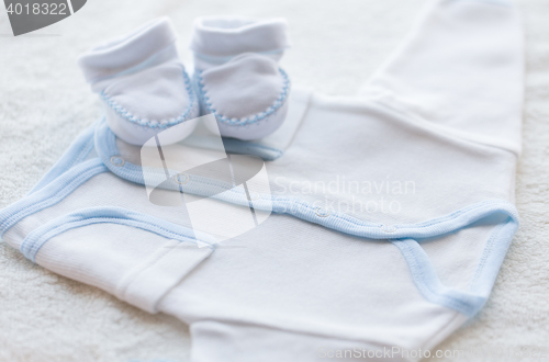 Image of close up of baby boys clothes for newborn on table