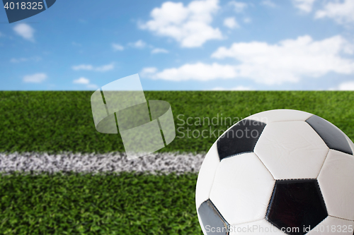 Image of close up of football or soccer ball over white