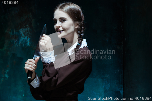 Image of Portrait of a young girl in school uniform as killer woman