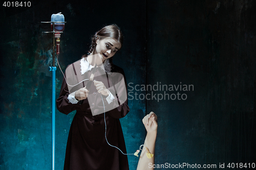 Image of Portrait of a young girl in school uniform as killer woman